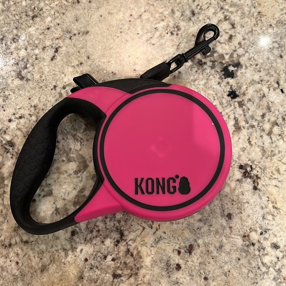Kong retractable pink leash. Approximately 16 ft. Maximum dog weight 45 lbs. - Picture 2 of 5